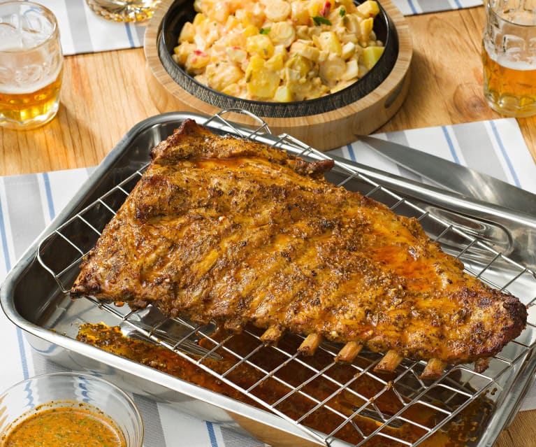 Costillar de cerdo asado al chimichurri con ensalada de patata y palmitos