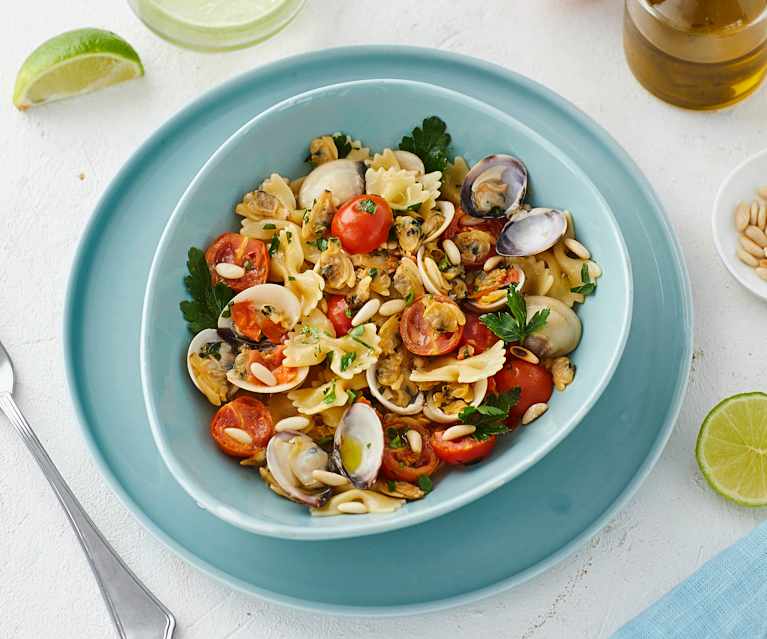 Farfalle risottate con vongole e pomodorini Farfalle risottate con vongole e pomodorini