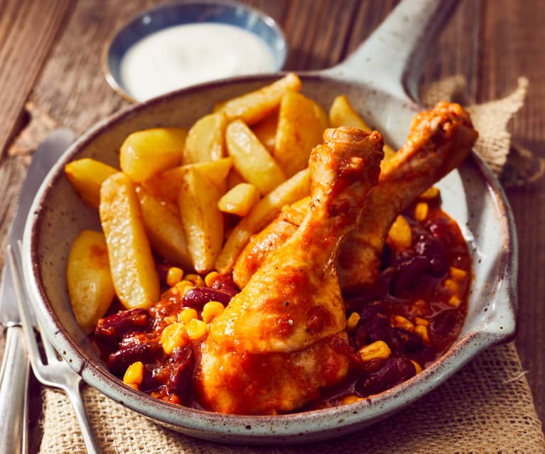 Drumsticks in scharfer Tomatensauce mit Kartoffelwedges