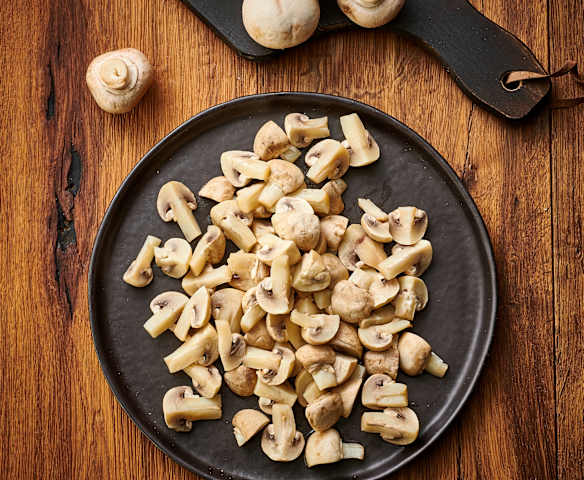 Champignons de Paris en quartiers vapeur (200-300 g)