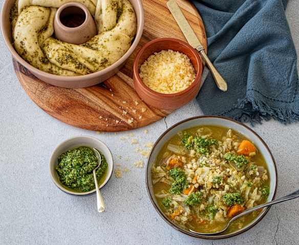 Chunky vegetable barley soup with seed pesto bread twist