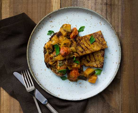 Eggplant and tomato breakfast hash with crispy tempeh