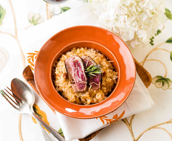 Risotto de naranja con magret de pato