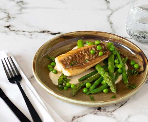 Crispy-skinned snapper with macadamia cream and spring vegetables