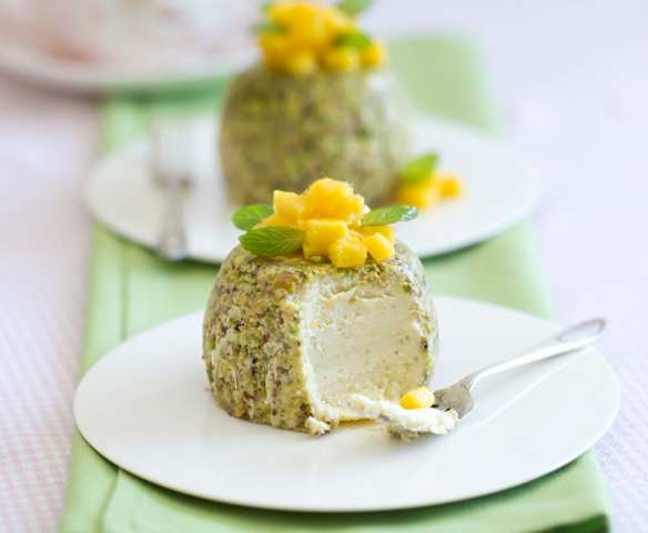 Steamed pistachio cheesecakes with mango
