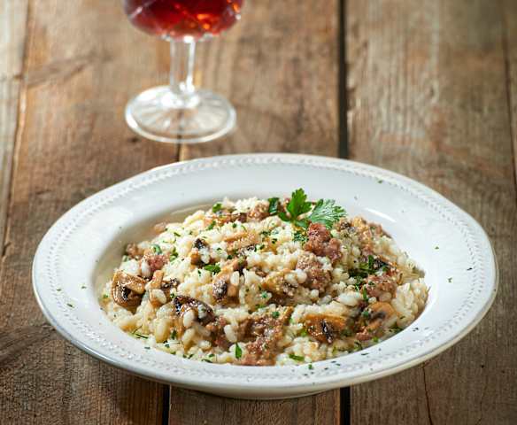 Risotto funghi e salsiccia Risotto funghi e salsiccia