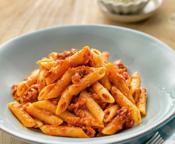 Pasta in tomato sauce with ham and chorizo