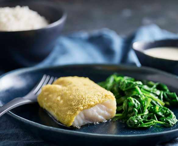 Bacalao en costra de hierbas con arroz y salsa de limón