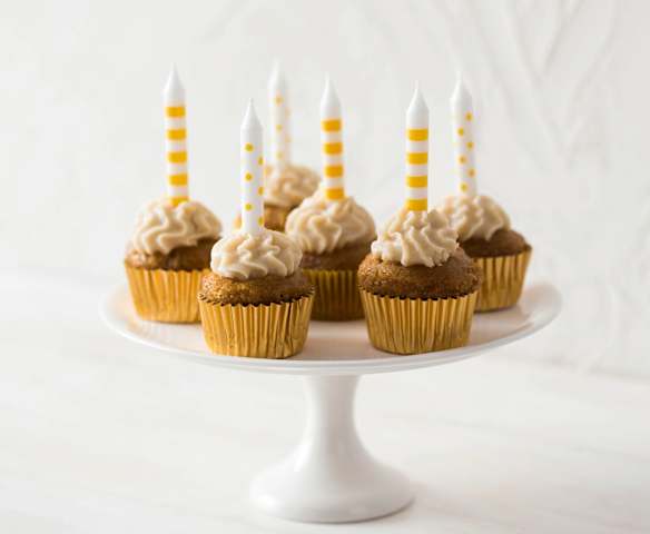 Mini caramelly cupcakes with coconut cream cheese topping