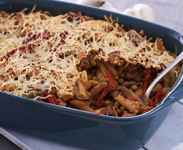 Pasta integral con champiñones, guisantes y pimientos del piquillo