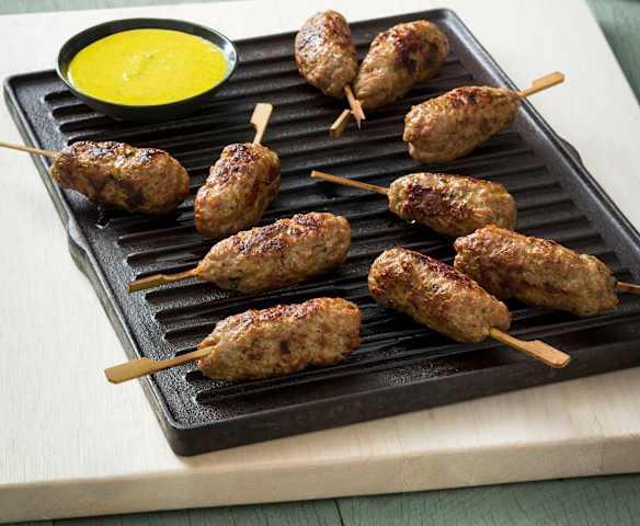 Prawn and pork pops with turmeric lime sauce