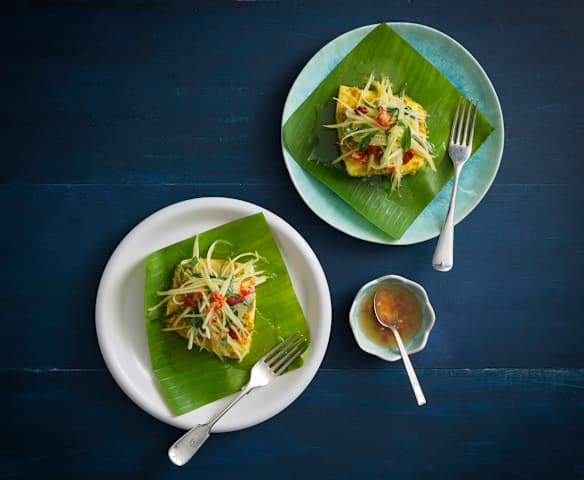 Steamed sea bass wrapped in banana leaves with green mango salad (Luke Nguyen)