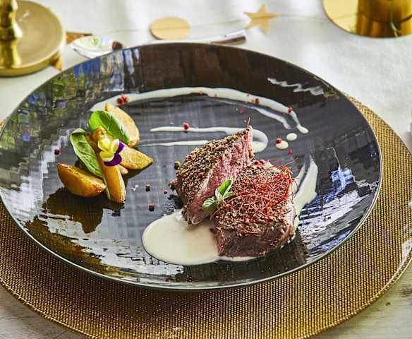 Filetto di Manzo sottovuoto con salsa al Gin e pepe