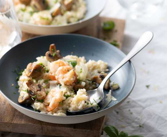 Risotto cremoso de champiñones y camarón.