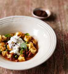 Wagyu beef manti with peas, pickled onions and garlic yoghurt