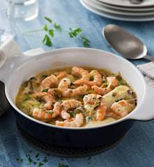 Puerros con langostinos en salsa de verde de cebolleta