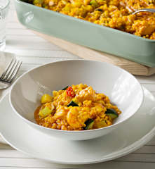 Arroz cremoso de gambones, salmón y verduras