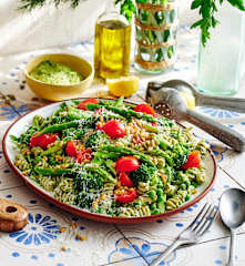 Layered veggie-loaded pesto pasta