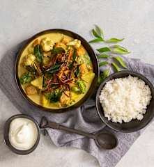 Sweet potato korma with crispy potato skins