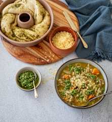 Chunky vegetable barley soup with seed pesto bread twist
