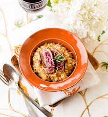 Risotto de naranja con magret de pato