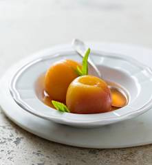 Peaches in white wine syrup