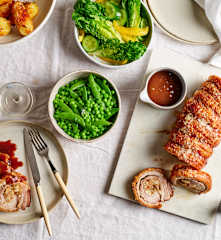 Roast porchetta with fig macadamia stuffing