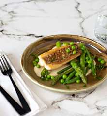 Crispy-skinned snapper with macadamia cream and spring vegetables