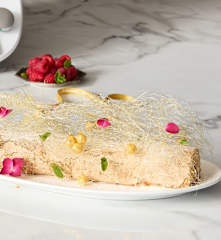 Hazelnut meringue roulade with spun sugar