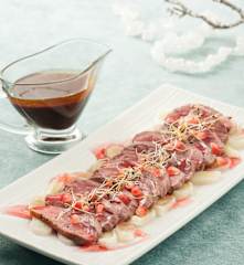 Magret de pato con salsa de granada