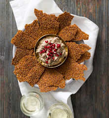 Linseed crackers with mutabbal beitinjan (eggplant dip)