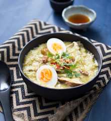 Mixed mushroom congee with pickled eggs