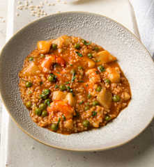 Arroz integral meloso con sepia y gambones