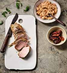 Pork fillet wrapped in prosciutto with barbecue butter