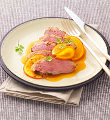 Magret de canard en papillote, sauce à l'orange