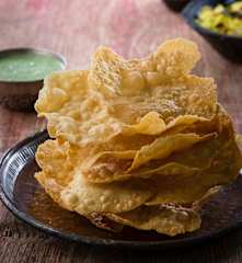 Pappadums with mint and coriander chutney