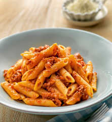 Pasta in tomato sauce with ham and chorizo