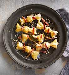 Caramelle ricotta e pere in salsa di speck