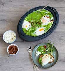 Pea shakshuka with bacon dust