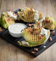 Grilled cabbage with blue cheese dressing and bacon