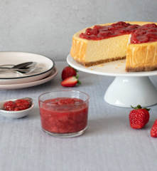 New York-style cheesecake with strawberry sauce