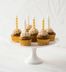 Mini caramelly cupcakes with coconut cream cheese topping