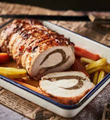 Rôti de porc farci aux champignons, purée à l'ail