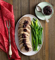 Turkey roll with cranberry and cherry sauce