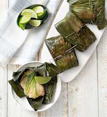White fish wrapped in banana leaves