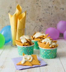 Homemade nacho chips with cheese sauce