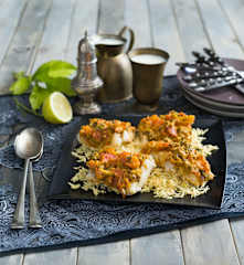 Steamed white fish with tomato and Indian spices