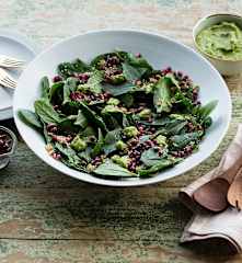 Spinach salad with crunchy quinoa and green goddess dressing