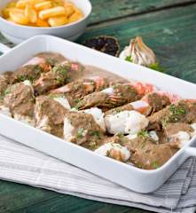 Suquet de pescado y gambones con ajo negro