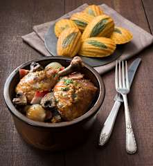 Coq au vin blanc with polenta madeleines
